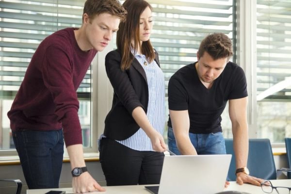People Using Laptop In Office People Using Laptop In Office